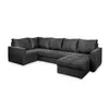 A dark gray sectional sofa with an ottoman, shown from a side-angle on a white background. Produktbild-Vorschau