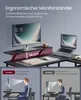 A desk setup with a monitor stand and a laptop, illustrating ergonomic benefits. Produktbild-Vorschau