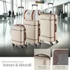 Suitcases and a duffel bag are arranged in an airport terminal. Produktbild-Vorschau