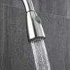 A close-up shot of a kitchen faucet spraying water. Náhľad obrázku produktu