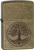 A close-up, front-facing view of a Zippo lighter with an antique brass finish, featuring an engraved 'Tree of Life' design. Náhľad obrázku produktu