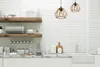 A modern kitchen with white subway tile backsplash, wooden shelves, and a marble countertop. Náhľad obrázku produktu