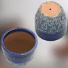 Two dark blue ceramic pots, one showing the interior and the other the exterior and base. Náhled obrázku produktu