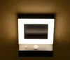 A wall-mounted outdoor light fixture with a modern design. Produktbild-Vorschau