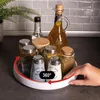 A rotating organizer filled with spices and oils on a kitchen counter. Produktbild-Vorschau