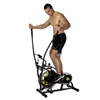 A man is using an elliptical trainer. Anteprima dell’immagine prodotto