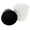 Two plastic plant pots, one white with a textured exterior and one black, are shown against a white background. The black pot is inverted and placed next to the white pot. Podgląd zdjęcia produktu