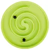 A top-down view of a green spiral maze toy with two black balls inside. Produktbild-Vorschau