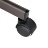 A close-up of a black caster wheel attached to a brown metal leg of a chair. Náhľad obrázku produktu
