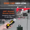A hand holding a wireless remote control for an electric hoist, with the hoist and a suspended load visible in the background. Produktbild-Vorschau