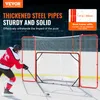 A hockey player practicing with a hockey net setup on an ice rink. Podgląd zdjęcia produktu