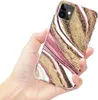 A hand holding a smartphone with a marble-patterned case. Produktbild-Vorschau