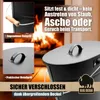 A close-up view of an ash bucket with text overlays highlighting its features, set against a backdrop of a fireplace with a roaring fire. Produktbild-Vorschau