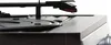 A close-up shot of a turntable's tonearm and needle over the platter. Produktbild-Vorschau