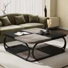 A modern living room scene featuring a couch and a coffee table. Podgląd zdjęcia produktu