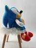 A Sonic The Hedgehog plush toy sitting on a small stool. Produktbild-Vorschau