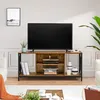 A TV stand with a television on top, placed in a living room setting. Podgląd zdjęcia produktu