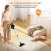 A woman is using a cordless vacuum cleaner in a living room, with a dog lying on a rug. Voir les images du produit