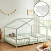 A child's bed with a house frame, set up in a bedroom with toys and decorations. Náhled obrázku produktu