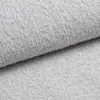 A close-up view of a light gray textured fabric, likely upholstery or bedding. Produktbild-Vorschau