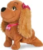 A plush toy dog named Lucy sits on a white background, wearing a pink collar with a name tag and a pink bow on her head. Náhľad obrázku produktu