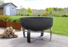 A fire pit with firewood on a wooden deck in a garden setting. Produktbild-Vorschau