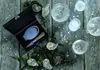 Oysters and champagne on a wooden table, with an oyster knife set in a box. Voir les images du produit