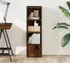 A tall, narrow bookshelf with several shelves, a drawer, and a cabinet door, placed against a white wall. Náhled obrázku produktu