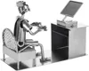 A metal figurine of a gamer sitting at a desk with a computer. Náhled obrázku produktu