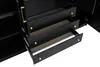 A close-up view of the drawers of a black cabinet with gold handles. Produktbild-Vorschau