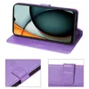 A purple flip case for a smartphone, shown open with the phone inside and propped up. Close-up views of the case's closure and embossed floral pattern are also shown. Produktbild-Vorschau