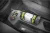 A flashlight is charging in a car's center console. Náhled obrázku produktu