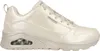 A side view of a beige Skechers sneaker. Voir les images du produit