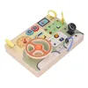 A wooden toy dashboard for toddlers with various interactive elements. Náhled obrázku produktu