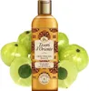 A bottle of Tesori d'Oriente shower oil surrounded by amla fruits. Anteprima dell’immagine prodotto
