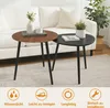 Two round coffee tables are placed in front of a white sofa, with a plant in a pot on one of the tables. The image also includes icons and text at the bottom. Produktbild-Vorschau