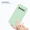A hand holding a light green phone case against a white background. Produktbild-Vorschau