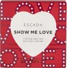 A close-up of a red perfume box with a white heart-shaped design in the center. The box has the brand name 'ESCADA' and the product name 'SHOW ME LOVE' printed on it. The background is decorated with the word 'LOVE' in large red letters with white polka do Produktbild-Vorschau