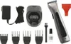 A collection of grooming tools and accessories, including a trimmer, charging base, power adapter, and various attachments, laid out on a white background. Produktbild-Vorschau