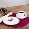 A coffee service set with chocolates on a wooden table. Voir les images du produit