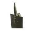 A close-up side view of a green metal shovel head and handle attachment. Produktbild-Vorschau