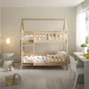 A wooden bunk bed in a child's room with bedding and toys. Produktbild-Vorschau