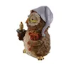 A figurine of an owl wearing a nightcap, holding a candle and a teddy bear. Produktbild-Vorschau