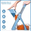A hand is using a blue mandoline slicer and vegetable chopper to cut carrots into julienne strips, which fall into a clear plastic container. Produktbild-Vorschau