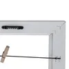 Close-up view of the back of a white picture frame, showing a sawtooth hanger, a wire with a clothespin, and the corner construction. Náhled obrázku produktu