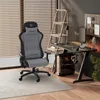 A gaming chair and desk setup in a home office environment. Produktbild-Vorschau
