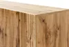 A close-up view of the corner of a wooden TV lowboard, showing the textured front panel and the smooth top surface. Náhľad obrázku produktu
