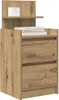 A wooden nightstand with two drawers and a small shelf on top, displaying a white clock and a stack of books. Náhled obrázku produktu