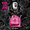 A bottle of Juicy Couture Viva La Juicy Noir perfume surrounded by black roses. Podgląd zdjęcia produktu