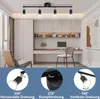 A modern office or study room with a desk, chair, and shelving unit, featuring a black LED ceiling track light. Produktbild-Vorschau